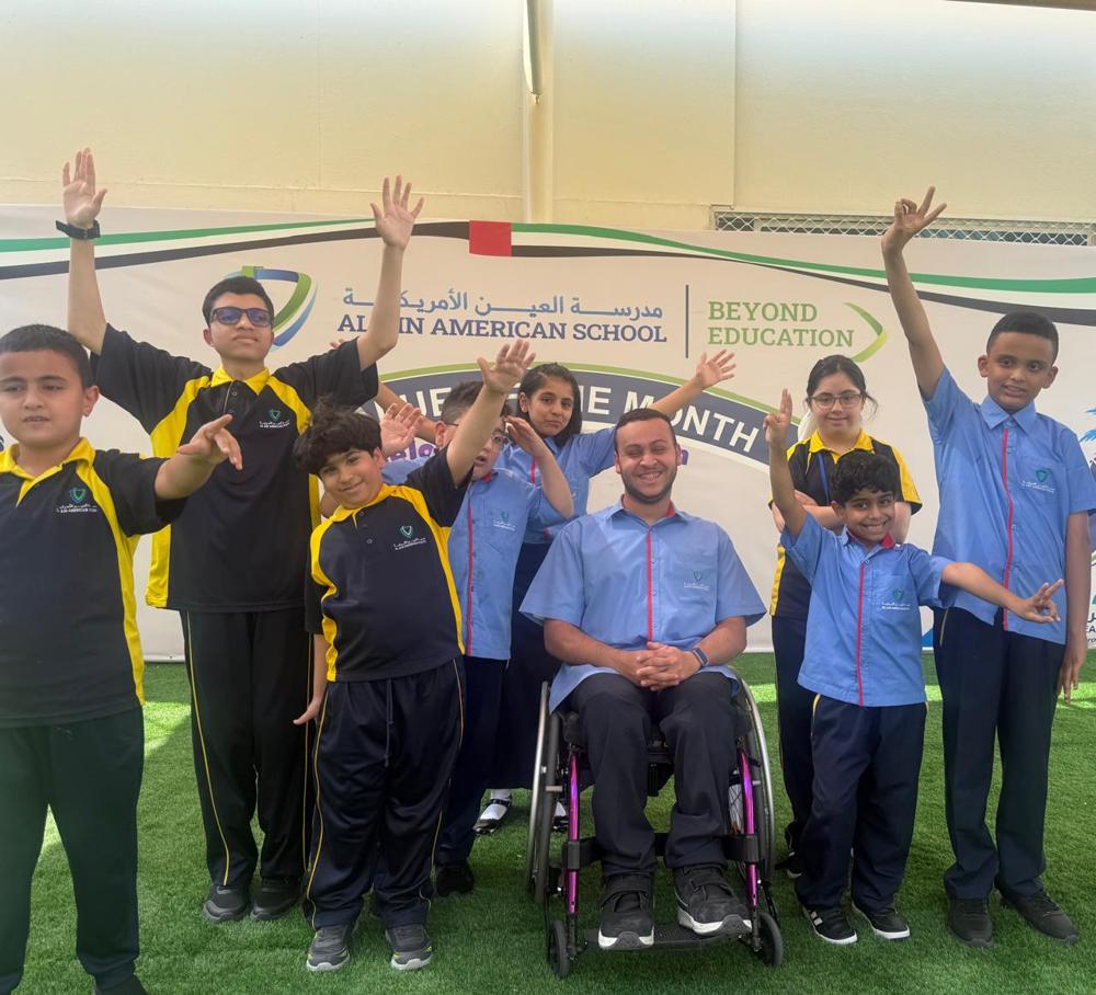 Students from the Additional Learning Support programme cheering with raised hands
